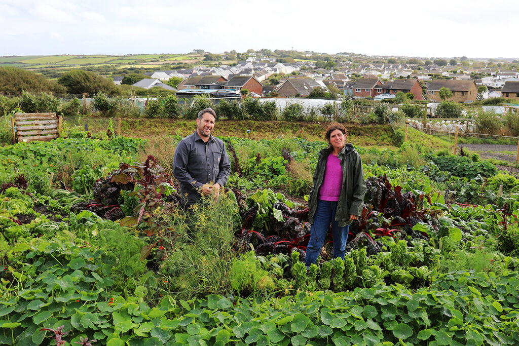 Ben Quinn and Hetty Ninnis in the Newquay Orchard CSA Market Garden.